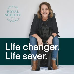 A woman sitting on a chair with a dog between her legs. Text reads Life changer. Life Saver